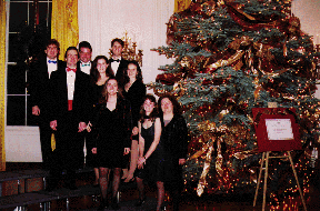 group posing in the White House
East Room